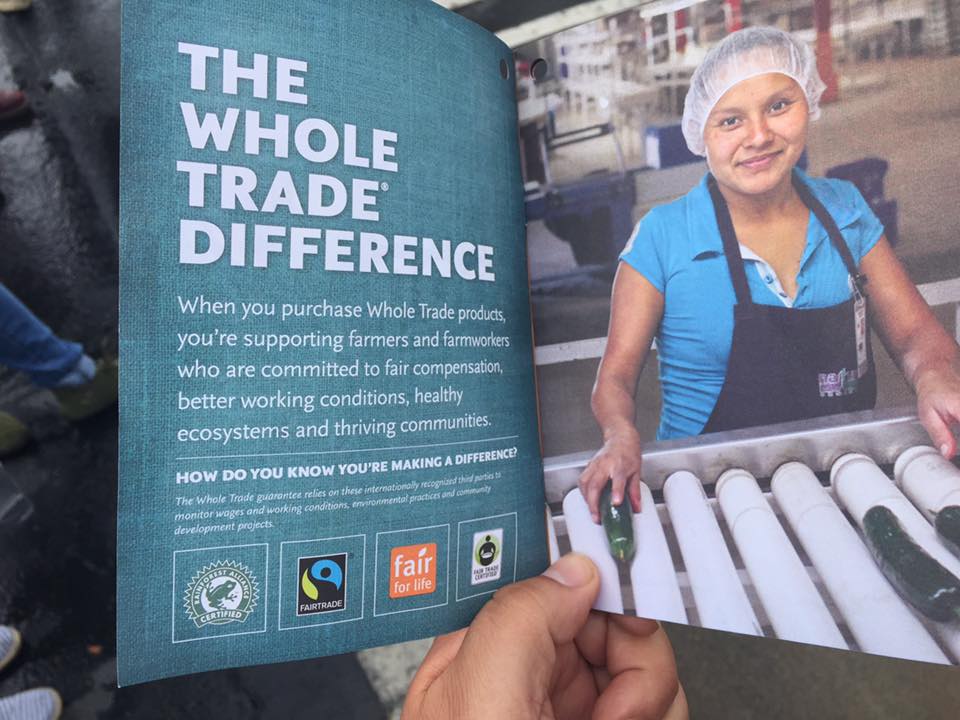 Photo by Xolotl Edgar Franx. May 28, 2016. A manager at the new Whole Foods Market in Bellingham, WA gave supporters of Families United for Justice and the international Driscoll's Boycott a booklet with information on "The Whole Trade Difference" when they were holding signs and distributing flyers in front of the store. Original photo caption by Xolotl Edgar Franx: More "fair trade" labels, no justice for farm workers.