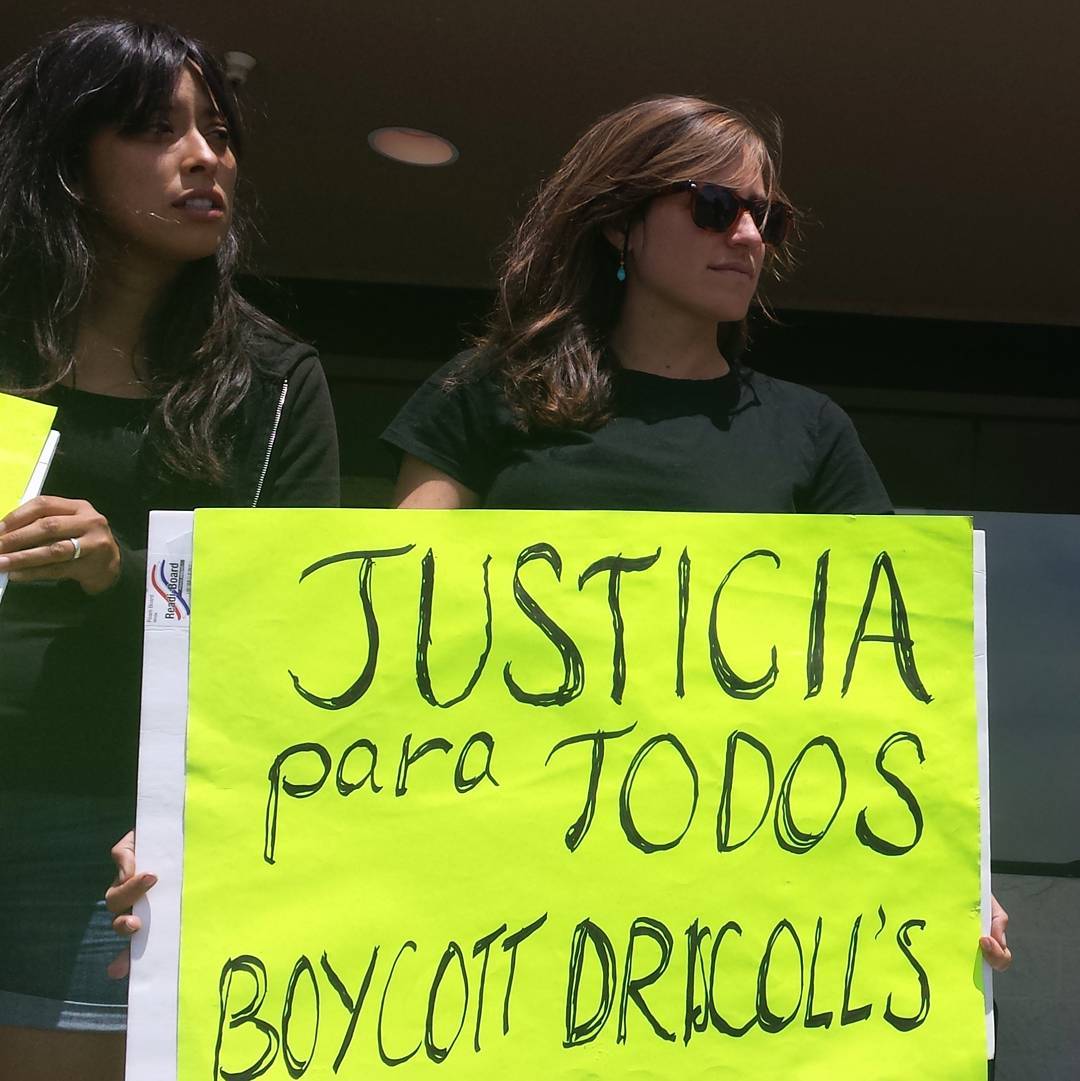 On a busy 4th of July weekend, Vivian and Katie hold signs in front of the Safeway in Watsonville, California advocating "Justice for All" and to "Boycott Driscoll's." July 2, 2016.